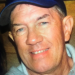 Headshot photo of Tom Duncan smiling